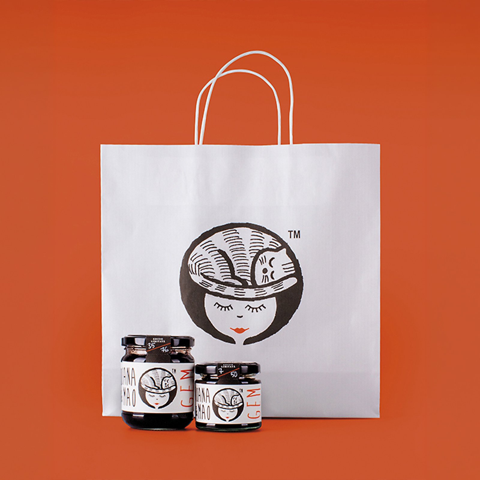 Ioana Mao jam jars and paper bag with sleeping-cat face illustration — packaging by Brandient
