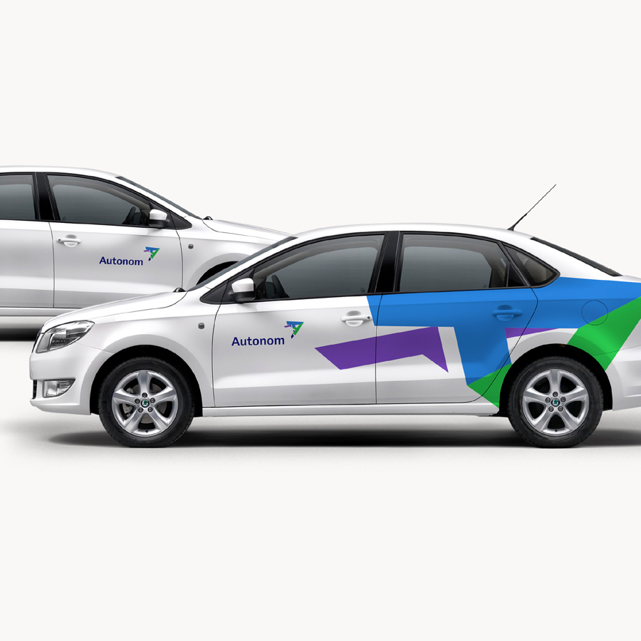 Autonom car livery on white sedans — rebranding by Brandient