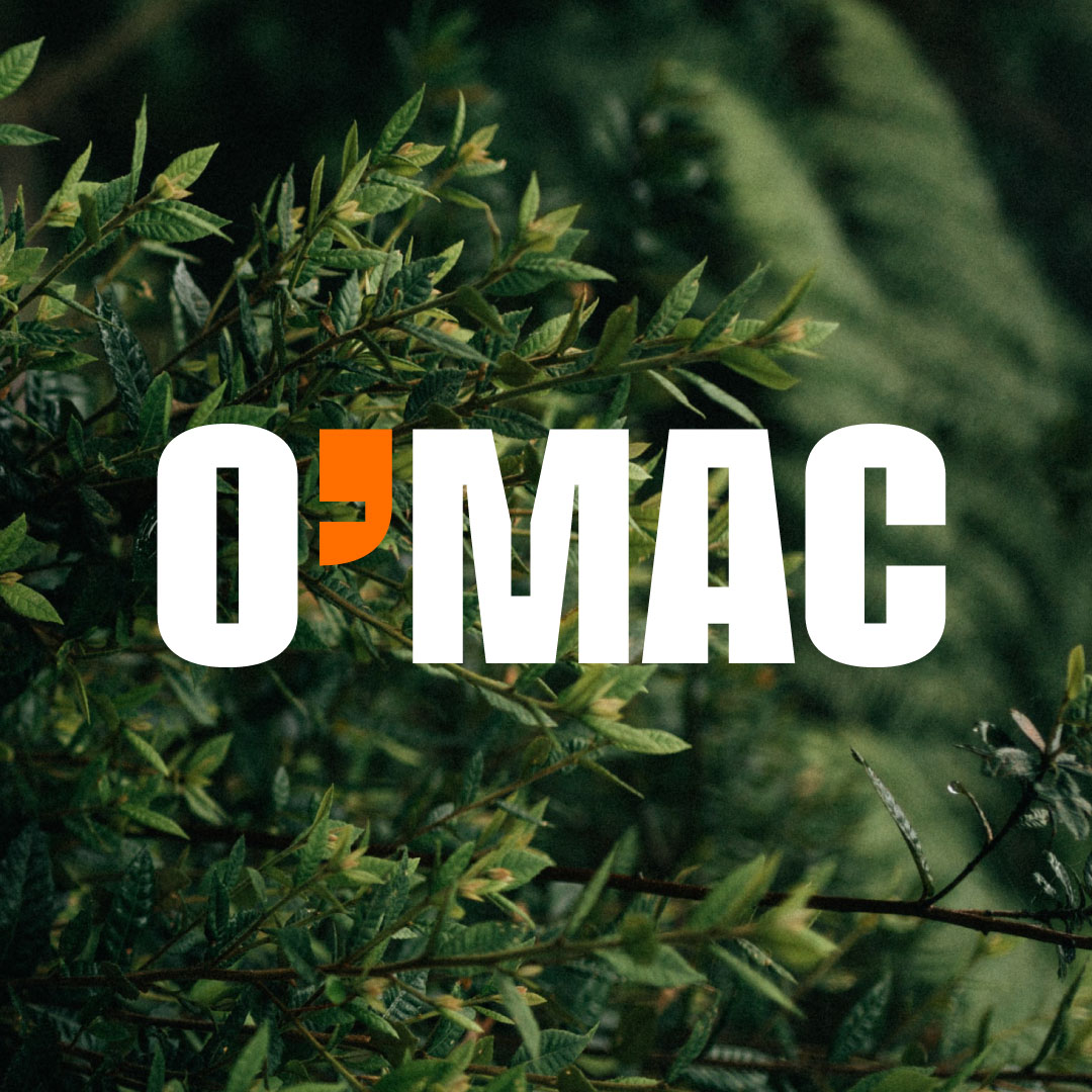 O’MAC logo in white with orange apostrophe over green foliage — rebranding by Brandient